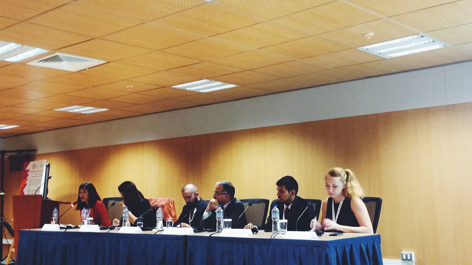 AI illustration: Panel of speakers at a World Bank and IMF Annual Meetings session