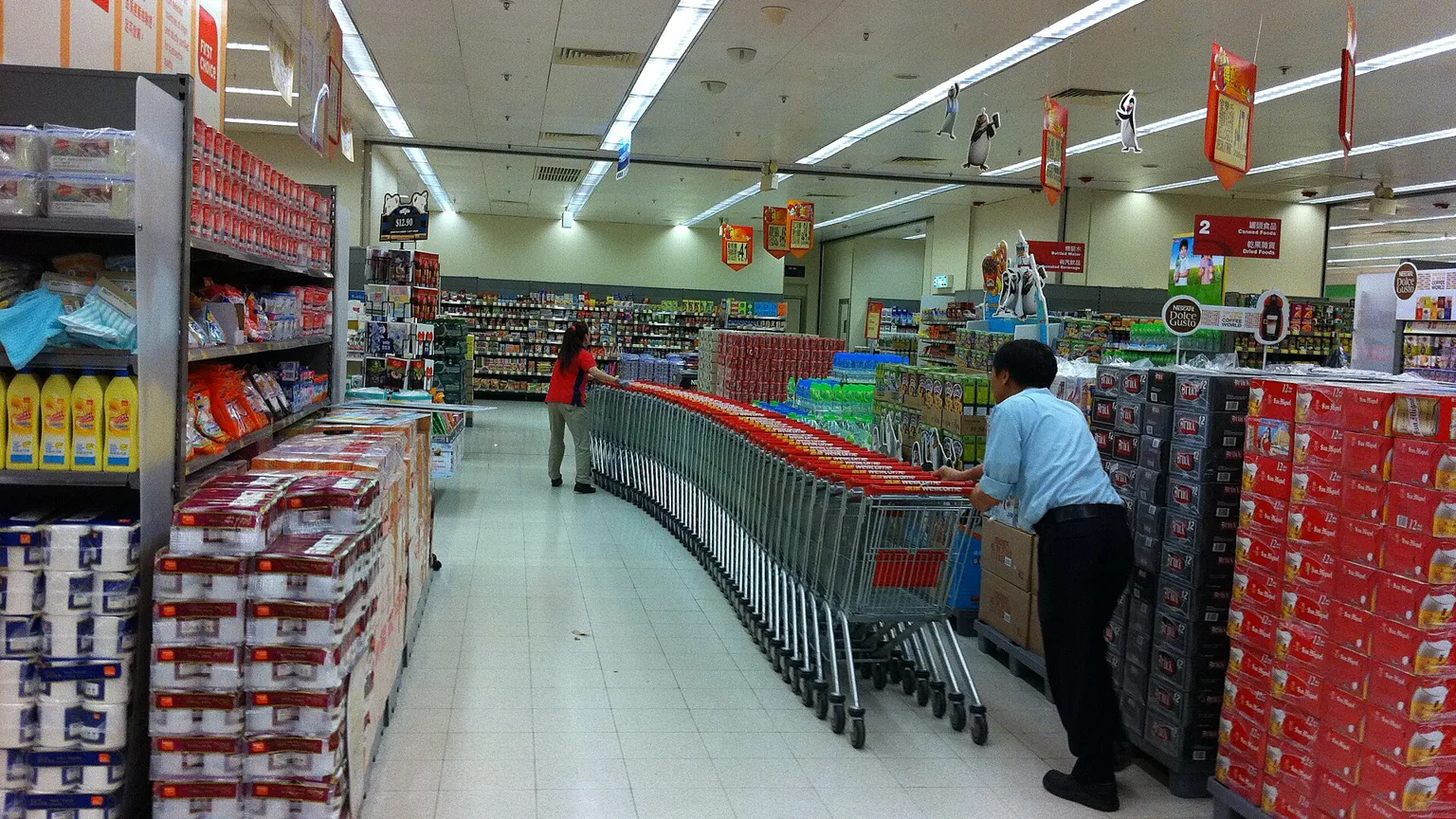 Shoppers in a supermarket aisle