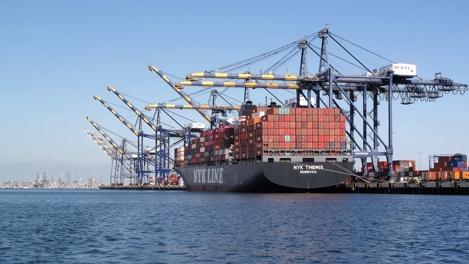 Container cranes and a cargo ship at a port